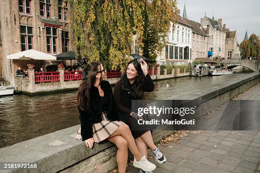 Two tourist women in Bruges, Belgium Two tourist women in Bruges, Belgium