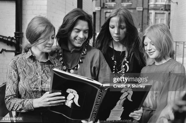 Actress and musician Marianne Faithfull, first right, and fashion models Penelope Tree, second right, and Christine Keeler, first left, with...