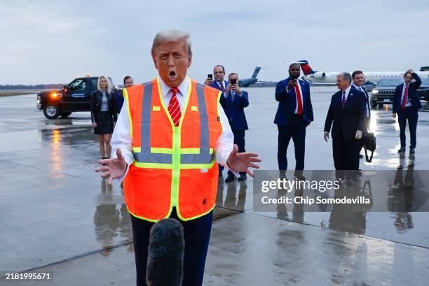 Republican presidential nominee, former President Donald Trump speaks to the media at Green Bay Austin Straubel International Airport on October 30,...