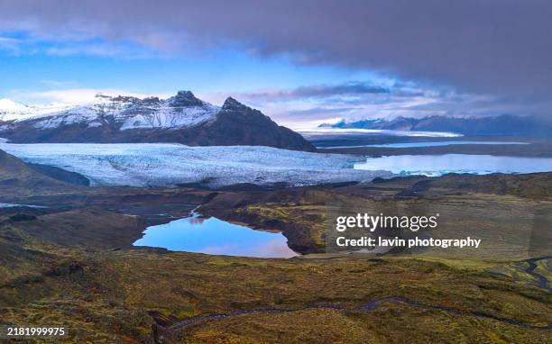iceland glacier with snow capped mountains - climate stock pictures, royalty-free photos & images