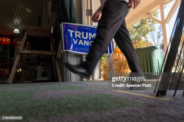 People arrive for a campaign rally for Republican senate candidate, Dave McCormick on October 30, 2024 in Pennsburg, Pennsylvania. The race between...