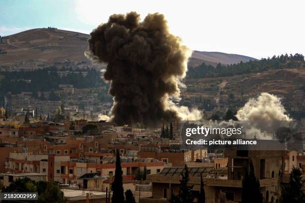 November 2024, Lebanon, Baalbek: Heavy smoke billows from an Israeli strike on the ancient city of Baalbek, amid ongoing conflict between Israeli...