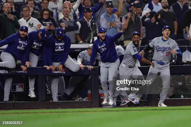 The Los Angeles Dodgers react as they defeat the New York Yankees 7-6 to win game 5 and the 2024 World Series against the New York Yankees at Yankee...