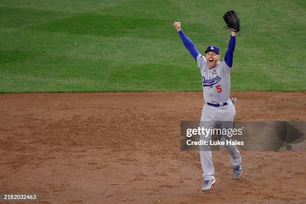 Freddie Freeman of the Los Angeles Dodgers celebrates as the Dodgers defeat the New York Yankees 7-6 to win game 5 and the 2024 World Series at...