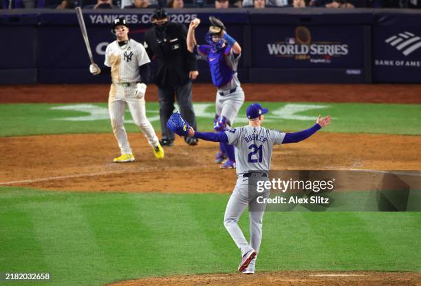 Walker Buehler and Will Smith of the Los Angeles Dodgers celebrate as the the Dodgers defeat the New York Yankees 7-6 in game 5 to win the 2024 World...