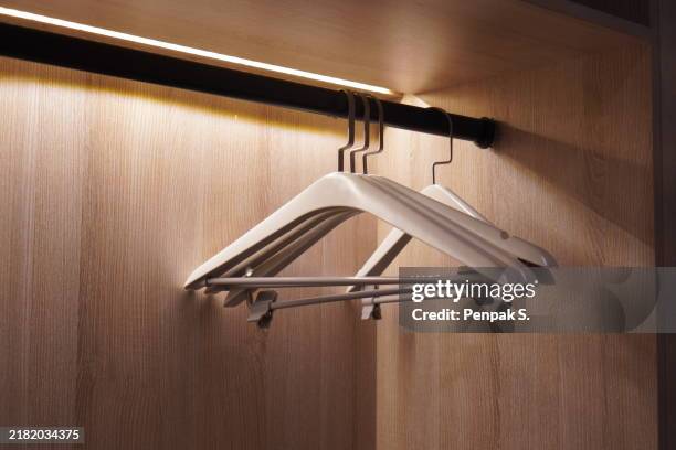 coat hanger - kleiderbügel stock-fotos und bilder