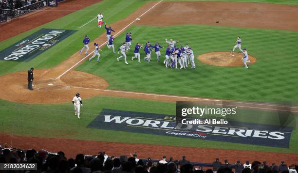 The Los Angeles Dodgers celebrate as the they defeat the New York Yankees 7-6 in game 5 to win the 2024 World Series at Yankee Stadium on October 30,...