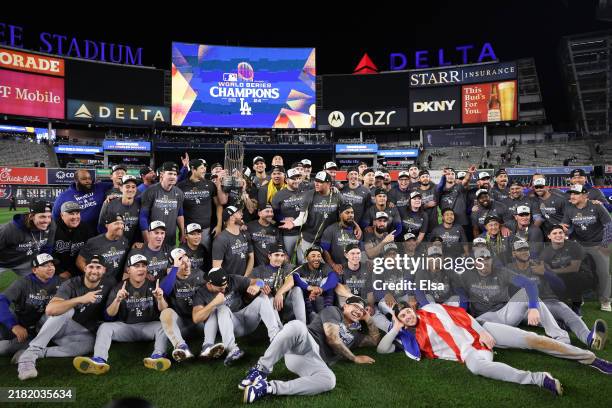 The Los Angeles Dodgers pose on the field after defeating the New York Yankees 7-6 in game 5 to win the 2024 World Series at Yankee Stadium on...