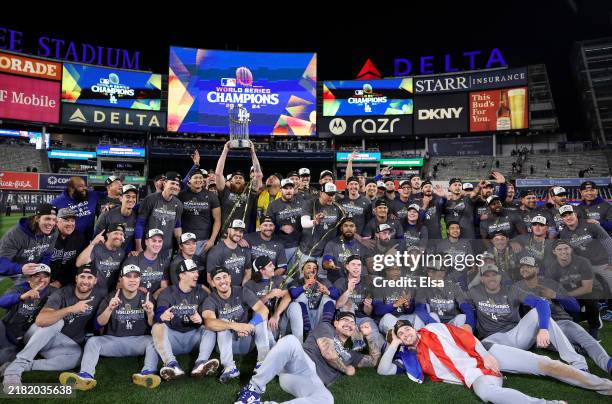 The Los Angeles Dodgers pose on the field after defeating the New York Yankees 7-6 in game 5 to win the 2024 World Series at Yankee Stadium on...