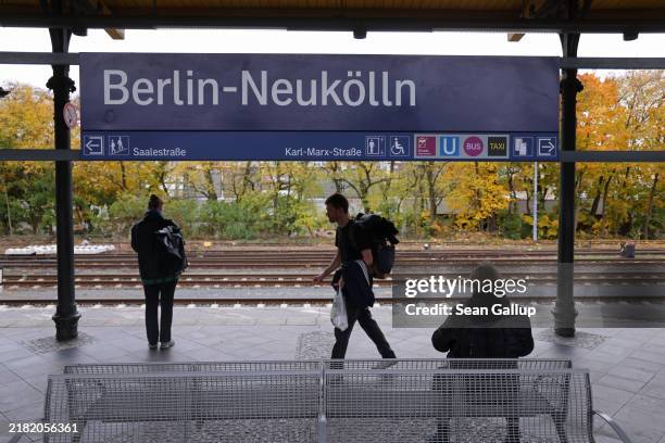 People stand on a platform at the Neukölln commuter trainstation on October 31, 2024 in Berlin, Germany. Yesterday late afternoon police at the...