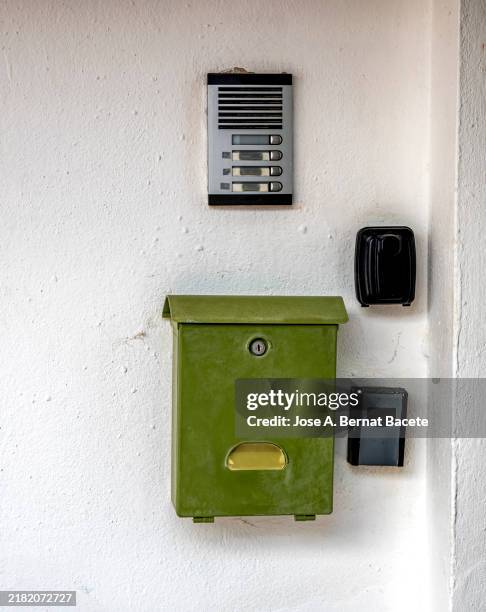 mailbox and several key box locked by code safes outside the apartment block in a vacation rental. - mailbox in the block stock pictures, royalty-free photos & images