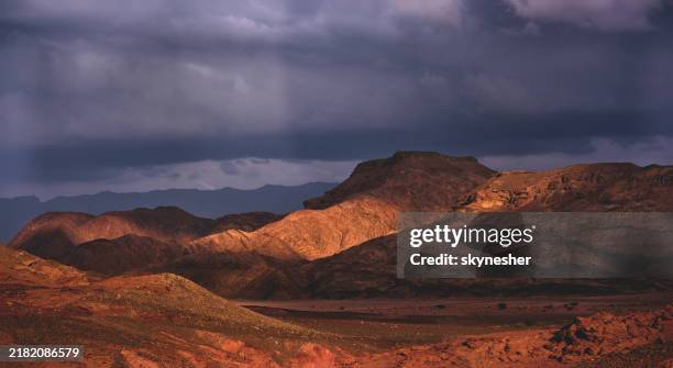sunbeam lightening parts of mountain range. - israel wilderness stock pictures, royalty-free photos & images