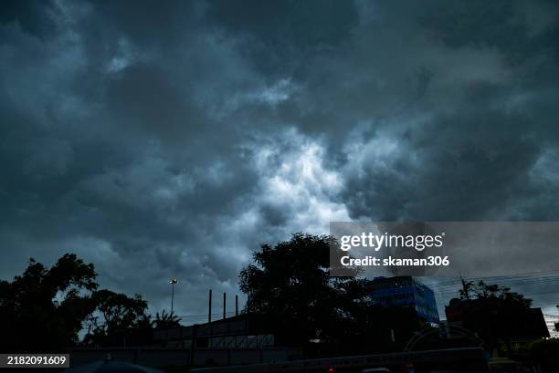 dramatic cloud before heavy rain falling against the lighting extreme weather and climate and global warming. - weather forecaster stock pictures, royalty-free photos & images