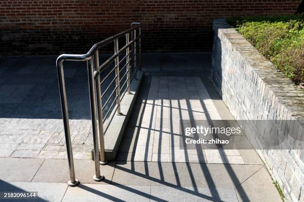 the effect of sunlight on the wheelchair ramp - wheelchair ramp stock pictures, royalty-free photos & images