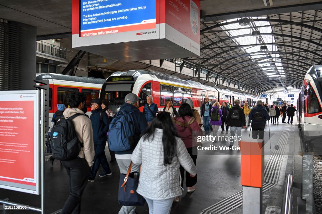 Travelers get advice at the ticket counter and information desk at Lucerne main station, Switzerland.