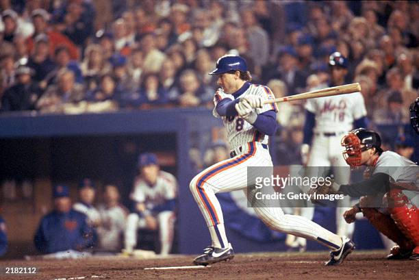 Gary Carter of the New York Mets swings at the pitch during the 1986 World Series game against the Boston Red Sox in October, 1986 at Shea Stadium in...