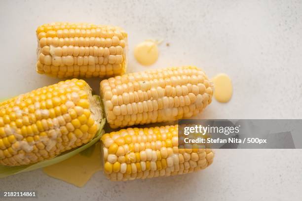 boiled corn cobs isolated on white background - corn on the cob stock pictures, royalty-free photos & images