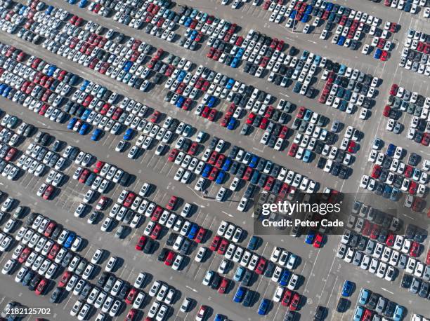 car park with brand new imported cars - automobile industry stock pictures, royalty-free photos & images