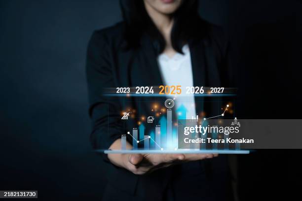 business professional analyzes future growth trends using data visualization tools - projection stock pictures, royalty-free photos & images