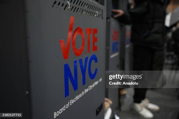 New Yorkers participate in early voting at a polling site at The Metropolitan Museum of Art on November 3 in New York City. New York City residents...