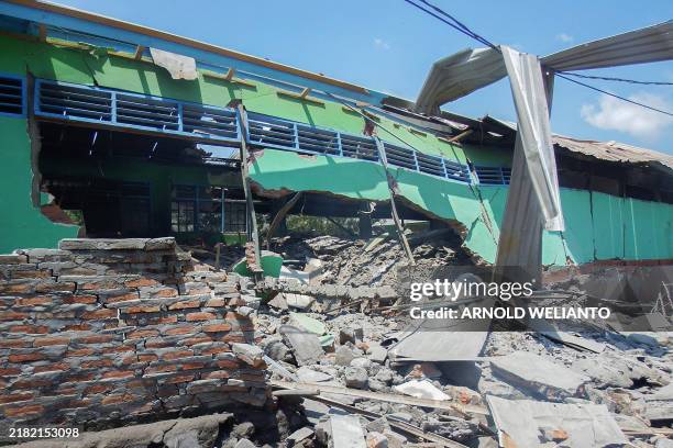 Collapsed building is seen in Klatanlo village, in East Flores Regency, East Nusa Tenggara, on November 4 in the aftermath of Mount Lewotobi...