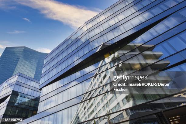 glass building with reflection of clouds and a blue sky in modern architecture, prime tower, zurich, glass façade, reflections, canton of zurich, switzerland, europe - blue glass office building stock illustrations