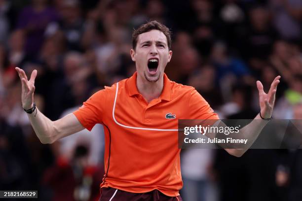 Ugo Humbert of France celebrates after winning match point against Carlos Alcaraz of Spain in their Men's Singles Third Round match on day four of...