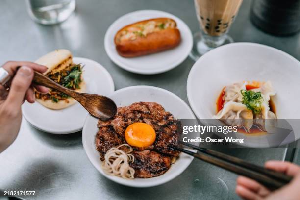 personal perspective of eating taiwanese grilled beef rice bowl - taiwanese culture stock pictures, royalty-free photos & images