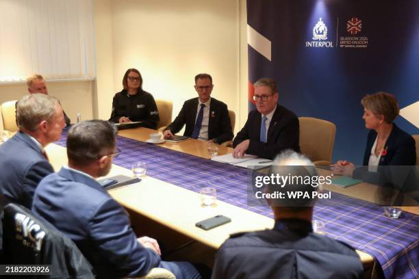 British Prime Minister Keir Starmer and Home Secretary Yvette Cooper attend a meeting with members of law enforcement agencies during the Interpol...