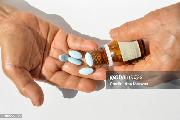prescription pill bottle, pouring pills from the bottle - drug side effects stock pictures, royalty-free photos & images