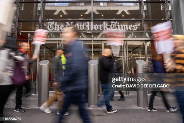 Members of The New York Times Tech Guild protest outside of the New York Times headquarters building in New York City on November 4, 2024.