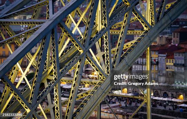 detail of the dom luís i bridge in porto, portugal at dusk - bridge architecture up close night stock pictures, royalty-free photos & images
