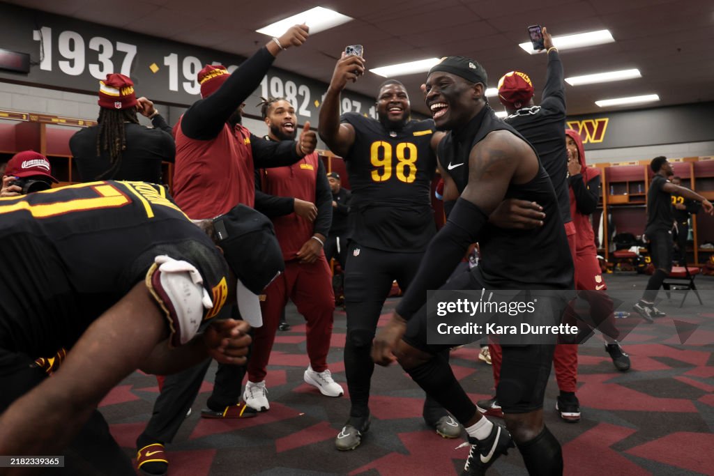 Mike Commanders Mike Sainristil of the Washington Commanders reacts in the locker ...