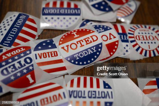 Stickers sit on a table during in-person absentee voting on November 01, 2024 in Little Chute, Wisconsin. Election day is Tuesday November 5.