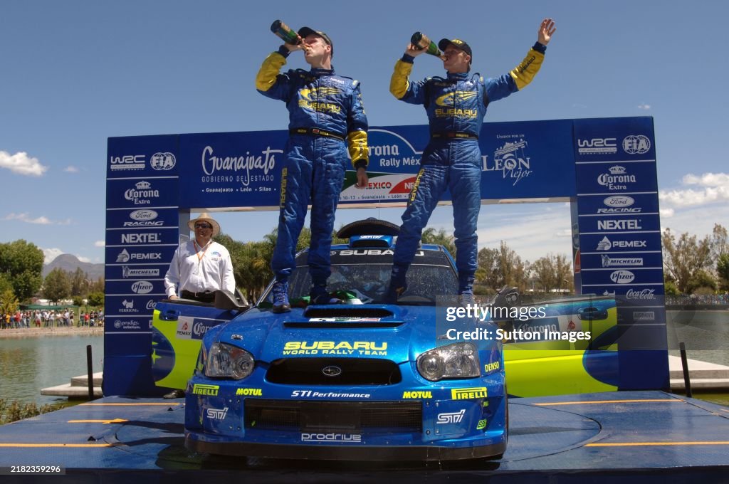 Subaru Rally Podium Phil Mills and Petter Solberg Subaru celebrate victory on the podium ...