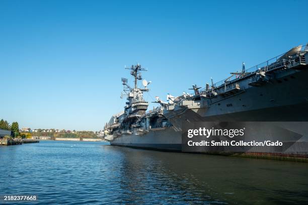 Aircraft carrier at the Intrepid Museum docked at a pier on a sunny day, New York City, New York, October 22, 2024.