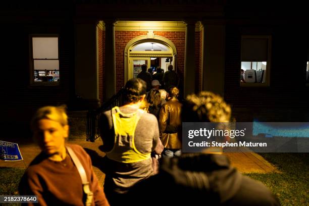 Voters line up outside a polling place at the Cincinnati Observatory on November 5, 2024 in Cincinnati, Ohio. Americans cast their ballots today in...