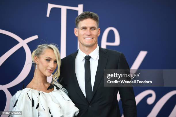 Lexi Mary and Rory Lobb pose for a photo during 2024 Derby Day at Flemington Racecourse on November 02, 2024 in Melbourne, Australia.