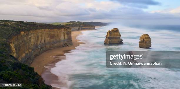 twelve apostle rock formation at the beach at great ocean road, victoria state. - limestone stock pictures, royalty-free photos & images
