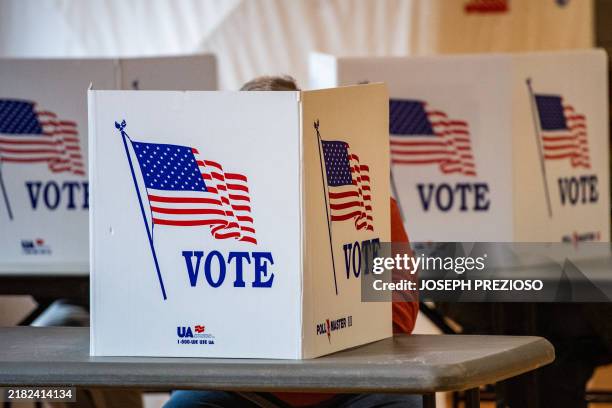 People vote at a polling station in Lancaster, New Hampshire, on Election Day, November 5, 2024.