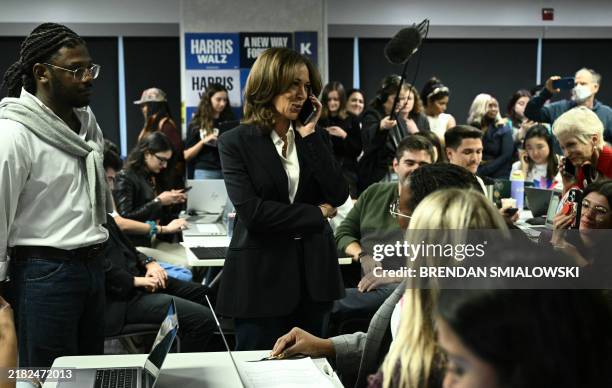 Vice President and Democratic presidential candidate Kamala Harris takes part in a phone bank at the Democratic National Committee headquarters in...