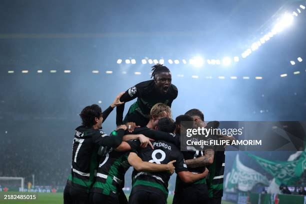 Sporting Lisbon's players celebrate after Swedish forward Viktor Gyokeres scored his team's fourth goal during the UEFA Champions League, league...
