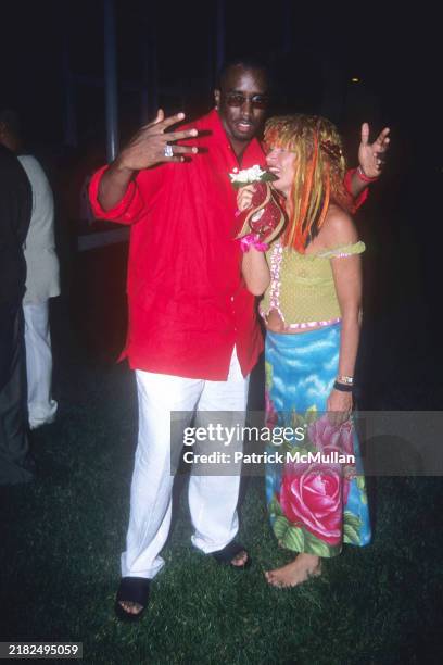 Sean Combs and Betsey Johnson attend Puffy's Fourth of July Party at Sean Combs' House on July 2, 2000 in East Hampton, NY.
