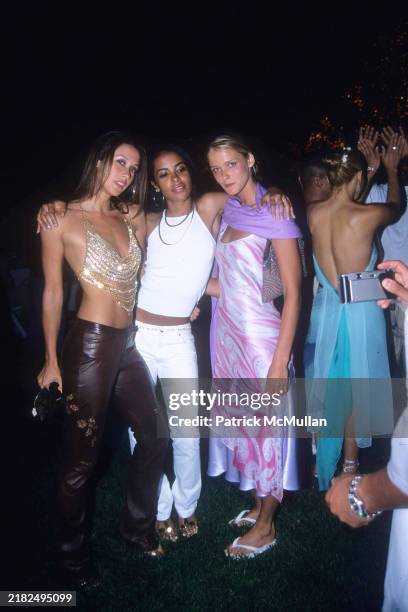 Natane Adcock, Aaliyah and Carmen Kass attend Puffy's Fourth of July Party at Sean Combs' House on July 2, 2000 in East Hampton, NY.