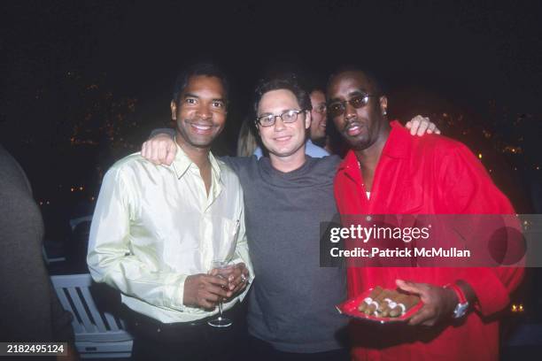 Guest, Jason Binn and Sean Combs attend Puffy's Fourth of July Party at Sean Combs' House on July 2, 2000 in East Hampton, NY.