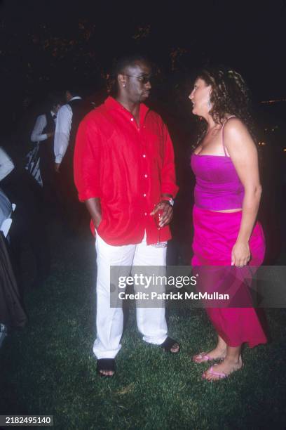 Sean Combs and Aida Turturro attend Puffy's Fourth of July Party at Sean Combs' House on July 2, 2000 in East Hampton, NY.