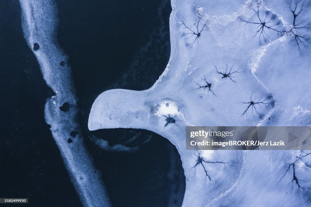 Drone view. Abstract forms created on surface of freezing lake