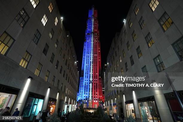 Rockefeller Plaza is illuminated in red, white and blue to mark Election Day, November 5, 2024.