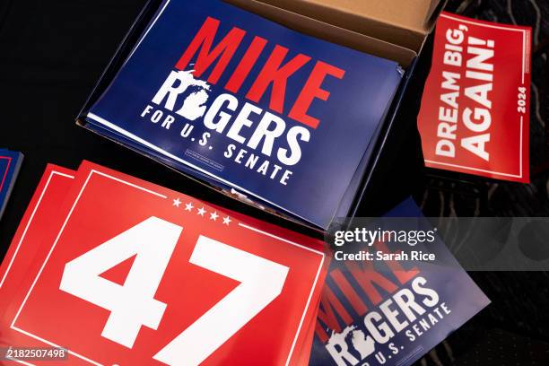 Signs for Republican US Senate candidate Mike Rogers are displayed on a table at an election night party on November 5, 2024 in Novi, Michigan....