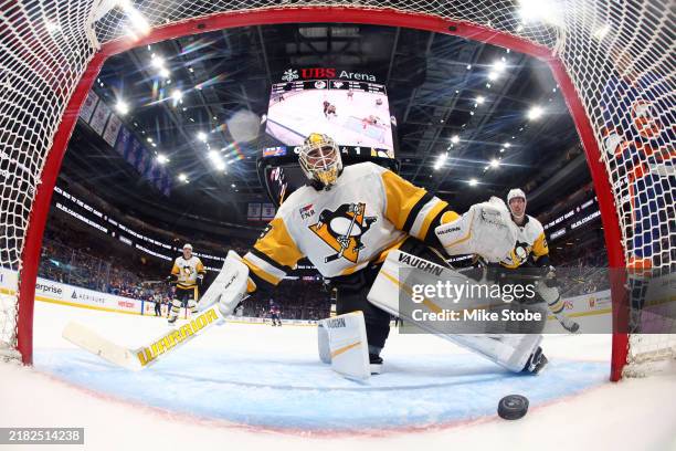Alex Nedeljkovic of the Pittsburgh Penguins reacts after allowing a goal to Kyle Palmieri of the New York Islanders during the first period at UBS...